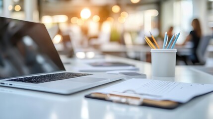A sleek corporate office with a desk in sharp focus displaying business documents
