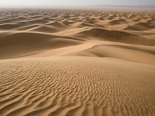 An Aerial View of Rippled Sand Dunes in a Desert Landscape