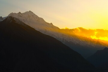 Sunset scenery of Rakaposhi (7788 m, Shining Wall, Dumani or Mother of Mist) - an extremely broad mountain situated in the Nagar and Bagrote Valley within the Karakoram range (Pakistan)