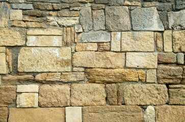Fototapeta premium Old light stone wall closeup