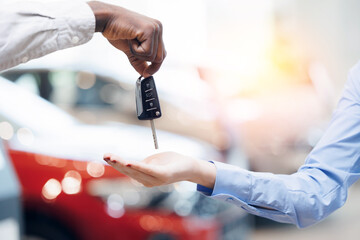 Man handing car smart key for woman. Concept Service rental and sharing