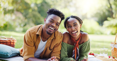 Love, relax and portrait of black couple at picnic for bonding, connection and happy outdoor adventure on weekend. Smile, man and woman in park for romantic date together with nature in green garden