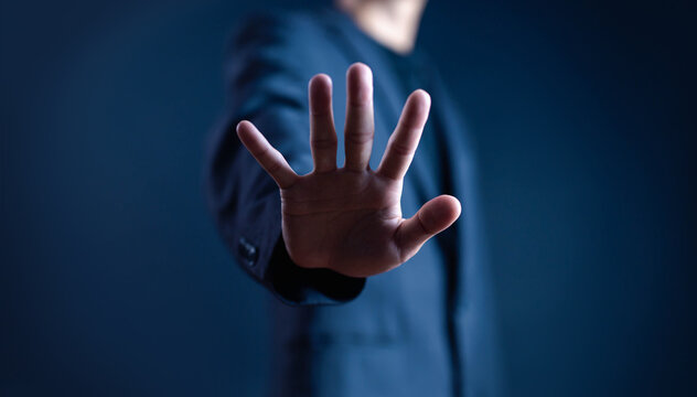 person's hand showing palm gestures stop, concept violence, warning, refuse, defense, caution. the hand sign of men a stop