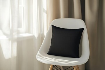 A mockup of a black square pillow on a chair
