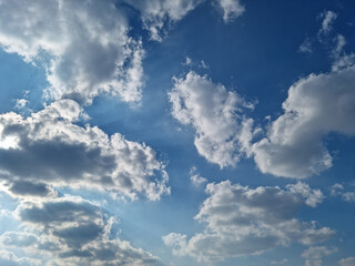 
Blue sky and white puffy clouds