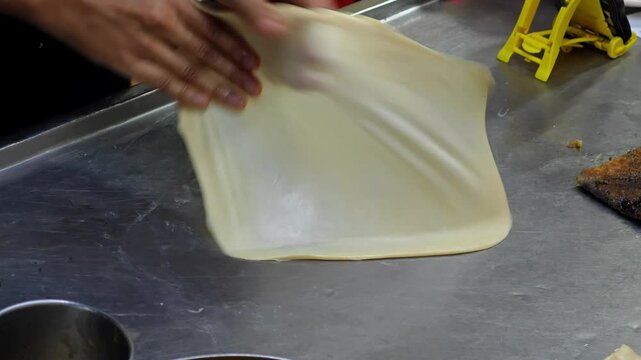 Kneading roti dough, street food.