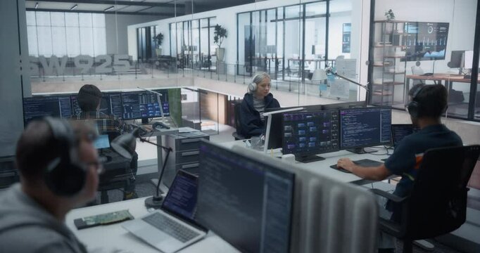 Male and Female Software Developers Working in a Modern Glass Office, Using Computers for Reviewing Lines of Code and Testing Artificial Intelligence Models to Drive Innovation in Their Project