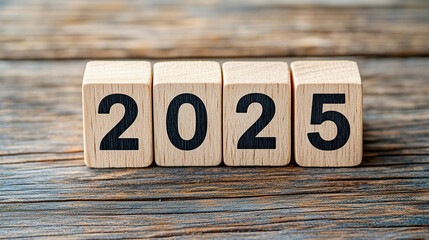 Wooden blocks with the numbers "2025" on a wooden background