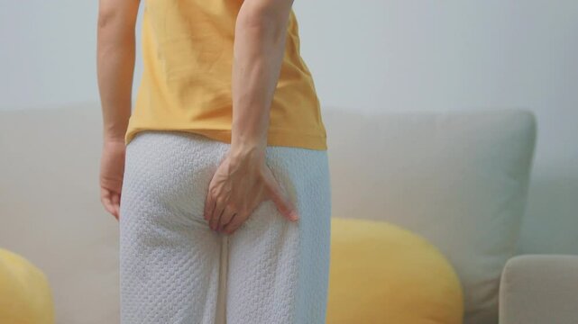 Woman having Abdominal pain. Hemorrhoids disease Constipation, Colorectal cancer. Digestive system, Health care and medical concept