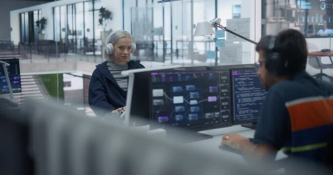 Portrait of a Young Caucasian Female Software Developer Working on Computer Together with an Indian Male Colleague. Data Protection Center with Servers, Storage Hardware and eBusiness Research
