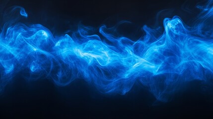 Obraz premium A vibrant blue smoke spray gently dispersing, isolated on a black background