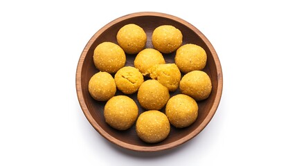 A wooden bowl holds several sweet.