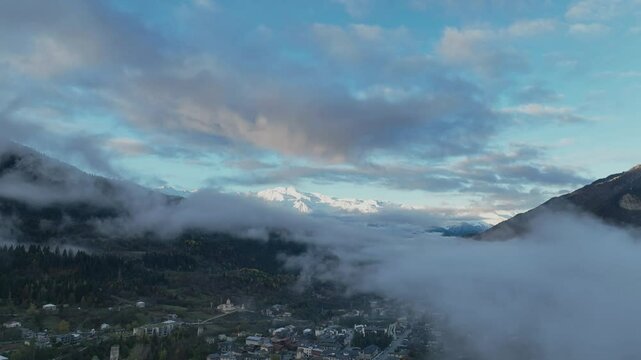 Aerial view with Mist  in the morning and the mountain View of Mestia village with Ushba mountain range background 