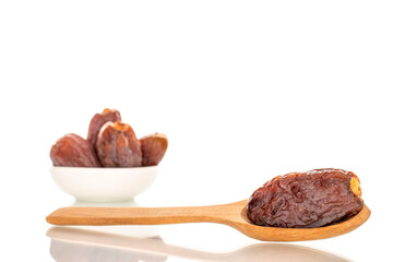 Dried sweet dates with homemade dishes isolated on white background, close-up.