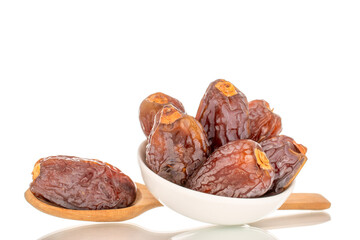Dried sweet dates with homemade dishes isolated on white background, close-up.
