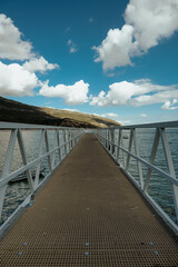 Fototapeta premium Pier surrounded. Portinho da Arrabida beach in setubal portugal.