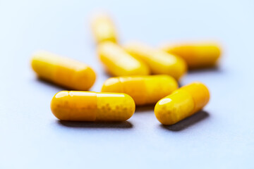 Vitamin C capsules. Bright background. Close up. Copy space.