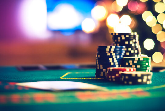 Close-up of a Stack of assorted poker chips and playing cards on a poker table at Christmas