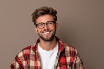 Fototapeta premium Friendly and Confident Person in Casual Wear, Beaming with Joy Against a Simple Background, Perfect for Lifestyle and Social Media Concepts