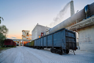 Freight gondola cars wait for loading of limestone products