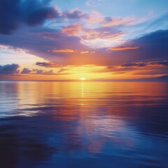 Obraz premium Sunset reflection over calm ocean waters coastal landscape photography serene atmosphere wide angle view nature's beauty