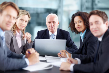 Obraz premium Business people, CEO and portrait with laptop in meeting for budget forecasting, stakeholder updates or planning. Financial executives, teamwork and review on finance reports with documents in office