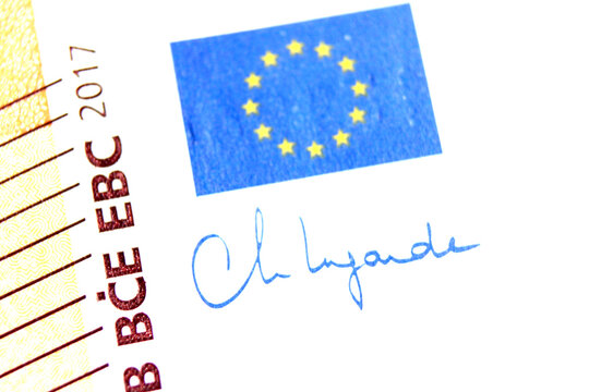 Close-up of a 50 euro banknote fragment with the flag of the European Union and the signature of the president of the ECB. Macro photography.