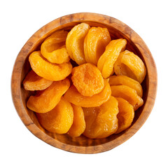 Dried apricots in wooden bowl isolated on white. Top view.