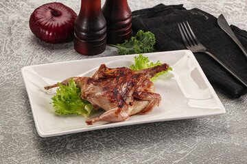 Grilled quail in the plate