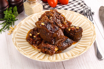 Prepared tasty beef ribs with sauce