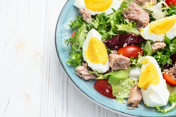 Canned Tuna salad with eggs and tomatoes photography . Top view
