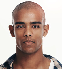 Obraz premium Portrait, confidence and man with skincare, natural beauty or bald on white studio background. Face, serious and African model with facial treatment for dermatology, healthy skin or handsome in Kenya