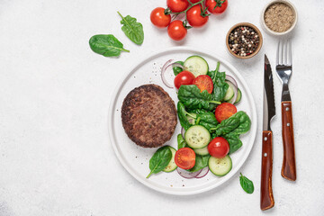 Grilled marbled beef with spinach salad on a plate on a white background with copy space. Protein lunch, healthy eating