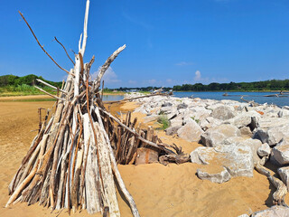 Wooden hut made of logs on the banks of the Tagliamento river in Bibione.