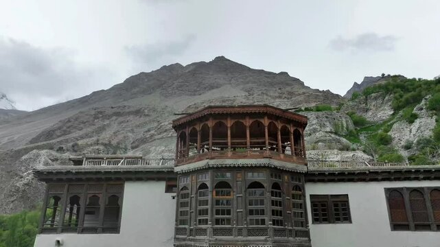 Aerial pull down view of famous Khapalu palace in Skardu with rocky hills at background in Pakistan.