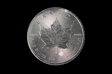 Canadian Silver Maple Leaf Coin on Black Background