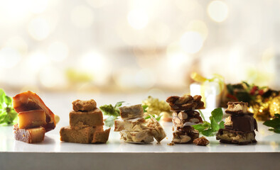 Nougat portions piled in a row with Christmas decoration