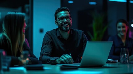 Smiling Man With Glasses Working on a Laptop in a Modern Office