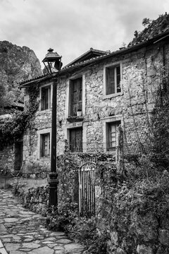 Picturesque houses in the village Cain de Valdeon, at the end of the Cares gorge hiking trail in the Picos de Europa mountains in Asturias, Spain