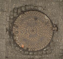 manhole cover in the street	
