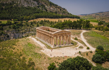 Ruins of Greek temple in ancient city of Segesta, Sicily, Italy. June 2023. Aerial drone picture.
