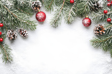 Festive Christmas decorations with pine branches, red ornaments, and pine cones create joyful winter scene. Perfect for holiday themes and celebrations