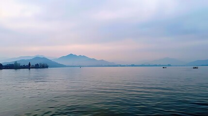 The Gorgeous Scenery of West Lake in Hangzhou with Its Calm Waters, Lush Greenery, and Graceful Bridges