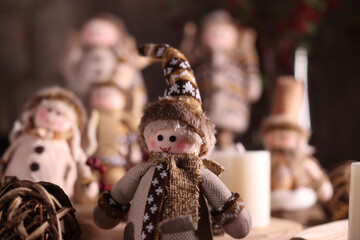 Handcrafted holiday figurines in cozy winter attire, perfect for festive and rustic holiday decor.