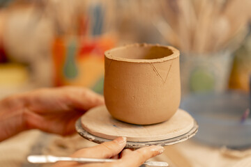 close-up in clay modeling studio applied art clay pottery old craftsmanship manual making of pottery smoothing out irregularities with a stack