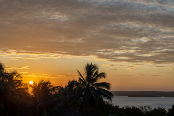 beautiful sunset on a lagoon. Tropical paradise.