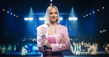 Portrait of a Beautiful Female Artist Standing on Stage at a Concert, Posing and Looking at Camera....