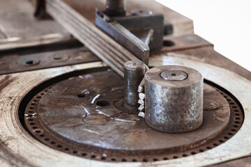 Reinforcing Bars Bending by Machine under Construction Closeup. Bender for Rebar Rods.
