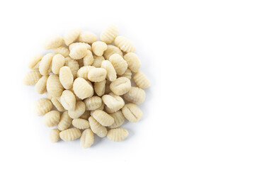 Tasty raw gnocchi isolated on white background. Top view. Copy space