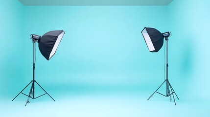 Two studio lights with softboxes are set up in a room with a blue backdrop.